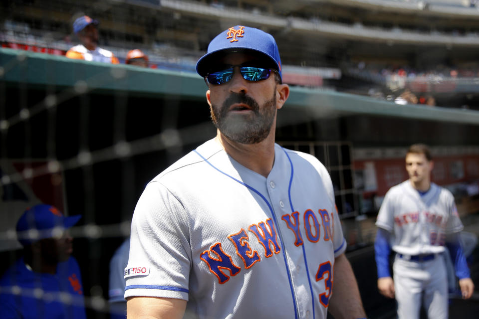 New York Mets manager Mickey Callaway stands in the dugout before a baseball game against the Washington Nationals, Thursday, May 16, 2019, in Washington. (AP Photo/Patrick Semansky)