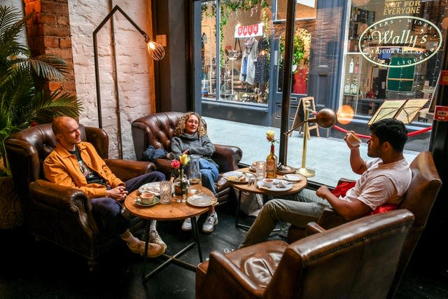 People enjoy a breakfast and coffee seated indoors in Cardiff