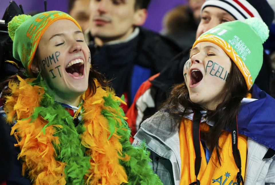 Australian fans cheer during the women's freestyle skiing aerials finals at the 2014 Sochi Winter Olympic Games in Rosa Khutor February 14, 2014. REUTERS/Mike Blake (RUSSIA - Tags: SPORT SKIING OLYMPICS TPX IMAGES OF THE DAY)