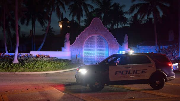 PHOTO: Authorities stand outside Mar-a-Lago, the residence of former president Donald Trump, amid reports of the FBI executing a search warrant as a part of a document investigation, in Palm Beach, Fla., Aug. 8, 2022. (Jim Rassol/EPA-EFE/Shutterstock)