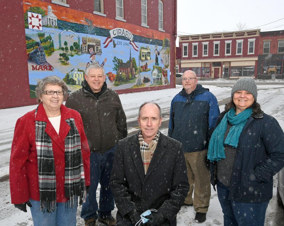 Borough officials and members of the Downtown Girard Inc. nonprofit organization then planning to seek Downtown Historic District designation from the National Register of Historic Places are shown in February 2021. From left are: Borough Councilwoman Jeanne Miller, Downtown Girard committee member Jim Tometsko, committee chair George Drushel, Borough Manager Rob Stubenbort and Melinda Meyer of Preservation Erie, who helped the committee with the project.