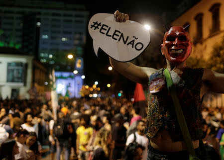 Demonstrator holds a sign that reads "Not Him" during a protest a against presidential candidate Jair Bolsonaro in Rio de Janeiro, Brazil September 29, 2018. REUTERS/Ricardo Moraes