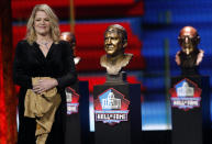 FILE - Carolyn Karras smiles after unveiling the bust of her father Alex Karras at the Pro Football Hall of Fame Enshrinement ceremony in Canton, Ohio, in this Wednesday, April 28, 2021, file photo. For all the acclaim that followed, Karras died at age 77 in 2012 without one of the honors he coveted most: a bust in the Pro Football Hall of Fame. “He believed in fairness and he said what needed to be said, whether it was appropriate or not,” Carolyn Karras said. “And I’m not sure how, but I got this picture of him going into the Hall stuck in my head. So I started finding out who the voters were. Two or three got back to me early on and were a great help.(Tom E. Puskar/AP Images for NFL, File)