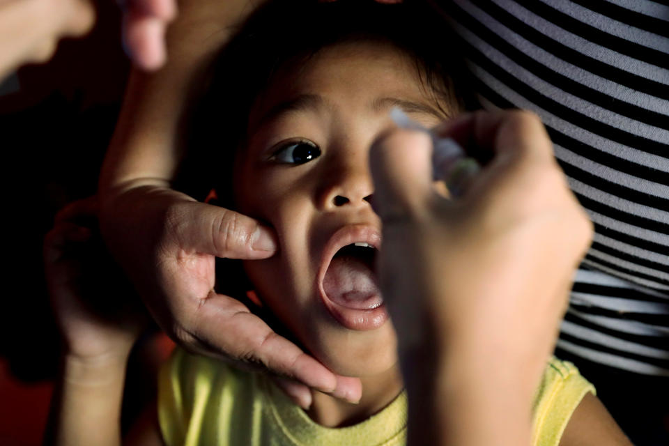 A child receives free polio vaccine during a government-led mass vaccination program in Quezon City, Metro Manila, Philippines, October 14, 2019. REUTERS/Eloisa Lopez