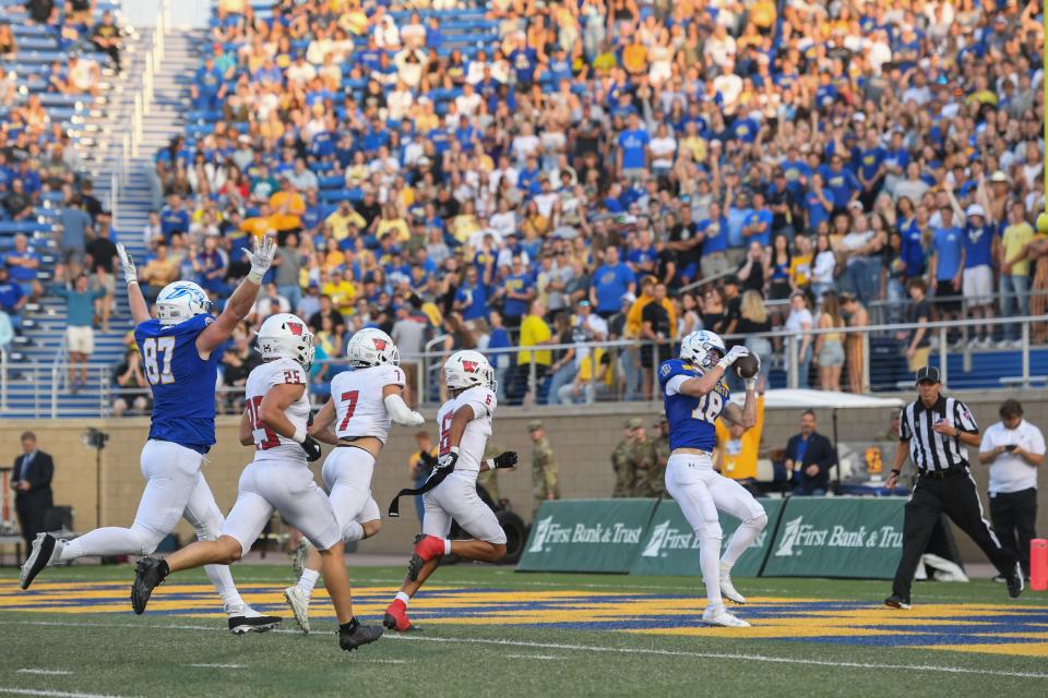 SDSU's Griffin Wilde (18) catches the ball for a touchdown at Dana J. Dykhouse in Brookings, South Dakota on Thursday, Aug. 31, 2023.