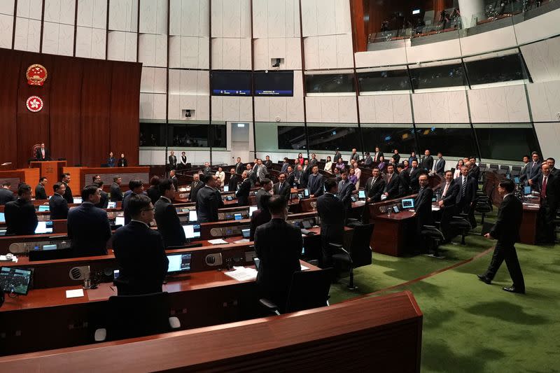 Hong Kong Chief Executive John Lee enters the chamber after the Basic Law Article 23 is passed