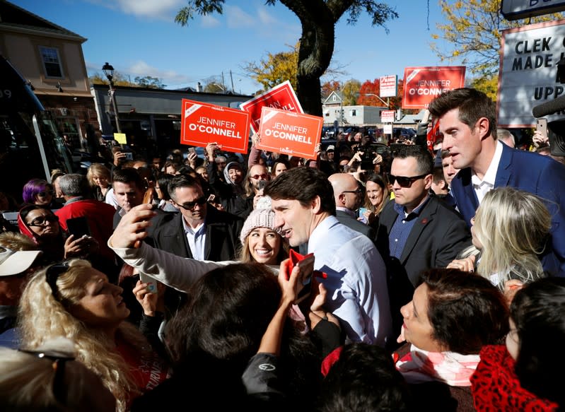 Liberal leader and Canadian Prime Minister Justin Trudeau poses for a photo as he campaigns for the upcoming election, in Whitby