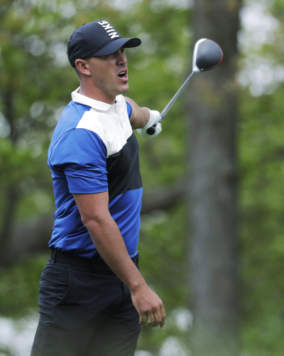 Brook Koepka reacts to his shot off the 12th tee during the final round of the PGA Championship golf tournament, Sunday, May 19, 2019, at Bethpage Black in Farmingdale, N.Y. (AP Photo/Julio Cortez)