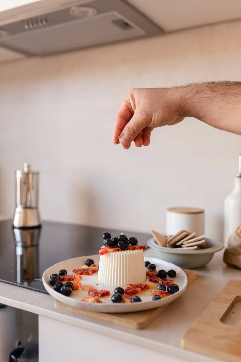 Garnishing panna cotta.