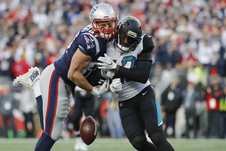 <p>New England Patriots tight end Rob Gronkowski (87) is hit by Jacksonville Jaguars strong safety Barry Church (42) during the second quarter in the AFC Championship Game at Gillette Stadium. Mandatory Credit: David Butler II-USA TODAY Sports </p>