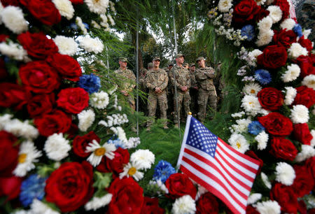 U.S. soldiers take part in a memorial ceremony to commemorate the16th anniversary of the 9/11 attacks, in Kabul, Afghanistan September 11, 2017. REUTERS/Mohammad Ismail