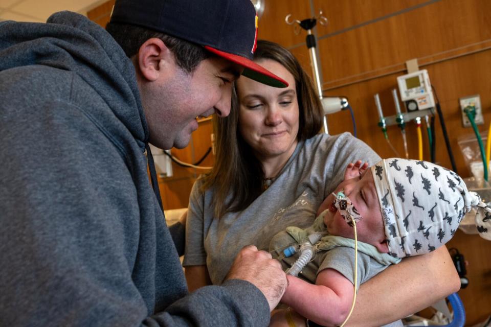 Justin and Caitlin Martin hold their son Connor