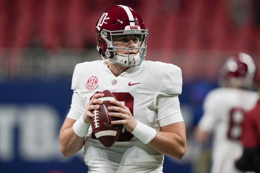 Alabama quarterback Mac Jones (10) warms up before the first half of the Southeastern Conference championship NCAA college football game against Florida, Saturday, Dec. 19, 2020, in Atlanta. (AP Photo/Brynn Anderson)