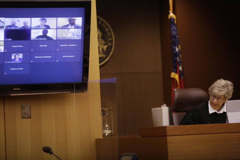 Judge Jane C. Barwick speaks during a bond hearing for former Atlanta police officer Garrett Rolfe who appears on a television screen on Tuesday, June 30, 2020, in Atlanta. Rolfe, who fatally shot Rayshard Brooks can be free on bond while his case is pending. A judge set a bond of $500,000 for Rolfe, who faces charges including felony murder in the killing of the 27-year-old Black man. Rolfe fatally shot Brooks in the back when Brooks fired a Taser in his direction while running away after a struggle on June 12. (AP Photo/Brynn Anderson, Pool)