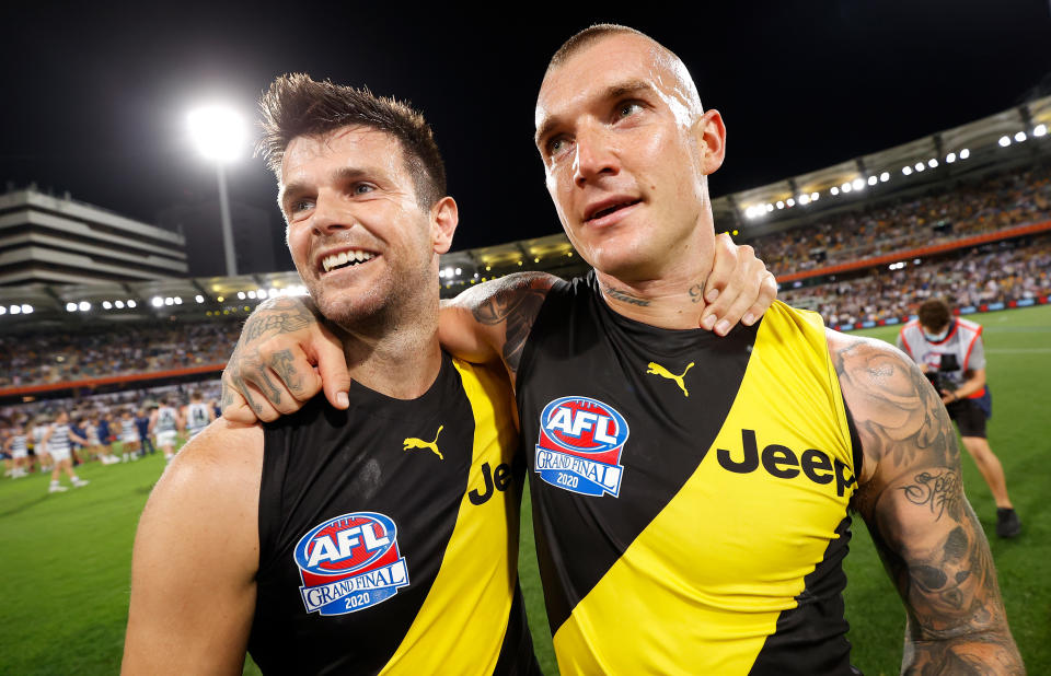 BRISBANE, AUSTRALIA - OCTOBER 24: Trent Cotchin and Dustin Martin of the Tigers (right) celebrate during the 2020 Toyota AFL Grand Final match between the Richmond Tigers and the Geelong Cats at The Gabba on October 24, 2020 in Brisbane, Australia. (Photo by Michael Willson/AFL Photos via Getty Images)