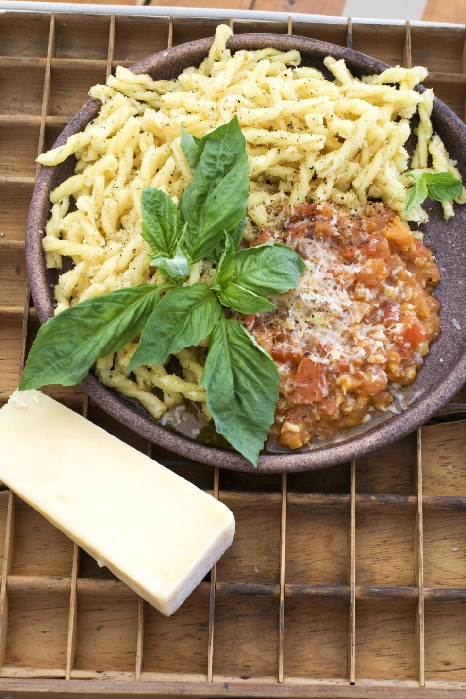 In this image taken on February 18, 2013, gemilli pasta with anchovies and breadcrumbs is shown served on a plate in Concord, N.H. (AP Photo/Matthew Mead)