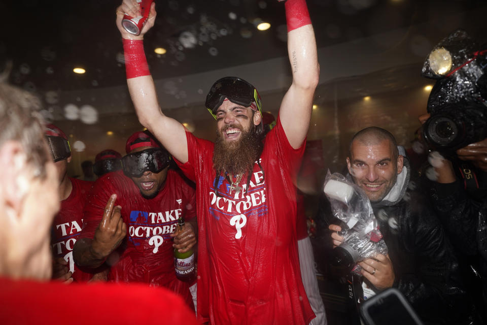 Philadelphia Phillies' Brandon Marsh celebrates after winning a baseball game against the Pittsburgh Pirates to clinch a wild-card playoff spot, Tuesday, Sept. 26, 2023, in Philadelphia. (AP Photo/Matt Slocum)