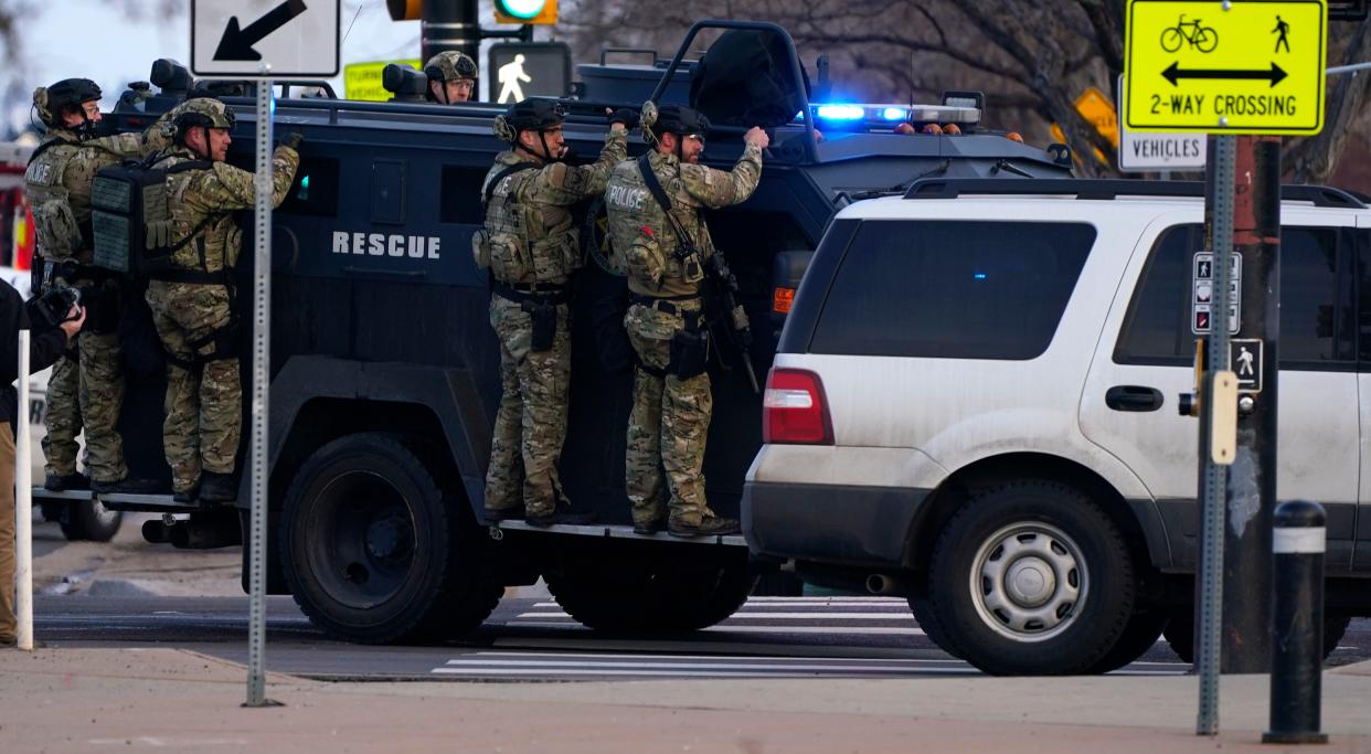 Police work on the scene outside of a King Soopers grocery store where a shooting took place Monday, March 22, 2021, in Boulder, Colo.