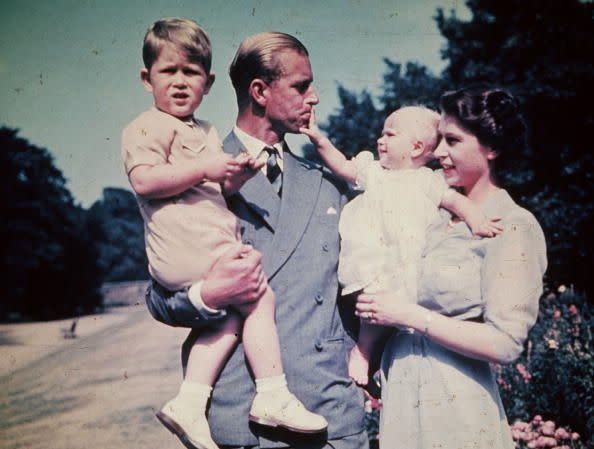 <p>Princess Elizabeth takes a quiet moment with her Prince Philip, Prince Charles, and Princess Anne.</p>