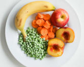 <b>Your Five a Day: at least five 80g portions of fruit and vegetables</b> It might sometimes seem like a struggle to get our recommended ‘five a day’ into our daily diet - but once you know what counts as a portion, it becomes easier. This plate contains a whole day’s ‘five a day’: 1 apple, 1 banana, 1 peach, and 3 heaped tablespoons each of carrot slices and peas. Frozen, canned and fresh fruit and veg all count towards your allowance.