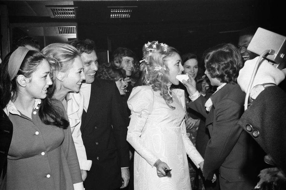 Roman Polanski feeds his new bride, Sharon Tate, cake during their wedding reception at the London Playboy Club in January of 1968. (Credit: David Housden and Harry Fox /Mirrorpix/Getty Images)