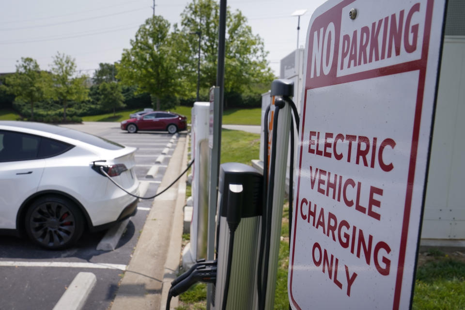 A Tesla electronic vehicle is charged at a Tesla charging station in Nashville in May. 