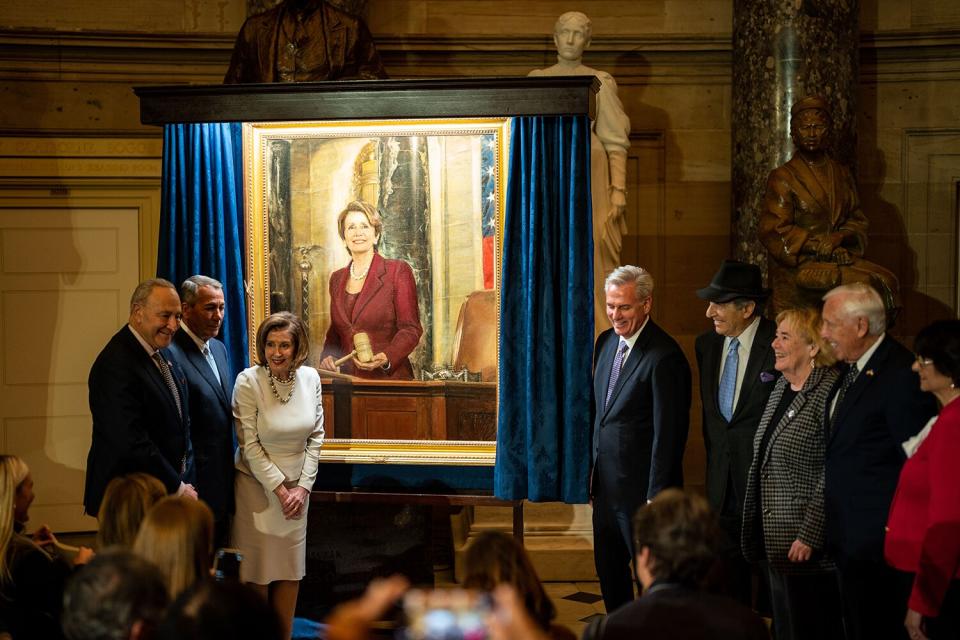 Speaker of the House Nancy Pelosi (D-CA) poses for photos with Senate Majority Leader Chuck Schumer (D-NY), Former House Speaker John Boehner (R-OH), House Minority Leader Kevin McCarthy (R-CA), Paul Pelosi, and others near her portrait following an unveiling ceremony in National Statuary Hall in the U.S. Capitol Building on Wednesday, Dec. 14, 2022 in Washington, DC.