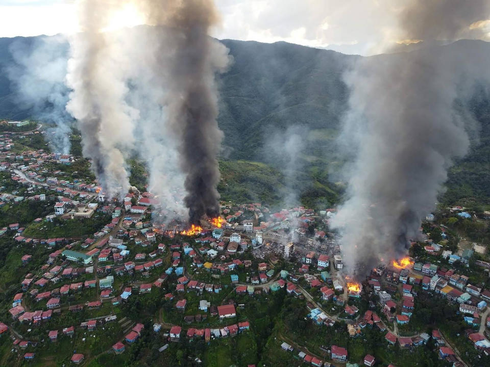 In this photo released by the Chin Human Rights Organization, fires burn in the town of Thantlang in Myanmar's northwestern state of Chin, on Friday Oct. 29, 2021. More than 160 buildings in the town in the northwestern Myanmar, including three churches, have been destroyed by fire caused by shelling by government troops, local media and activists reported Saturday. (Chin Human Rights Organization via AP)