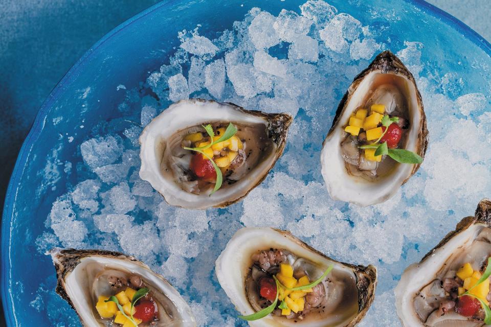 Well accessorized oysters on the half shell are served at the new AquaGrille in Juno Beach.