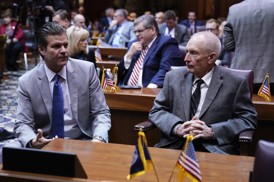 Rep. Jeff Thompson, right, R-Danville, and Sen. Ryan Mishler, R-Bremen, talk before Gov. Eric Holcomb delivers his State of the State address to a joint session of the legislature at the Statehouse, Tuesday, Jan. 10, 2023, in Indianapolis. (AP Photo/Darron Cummings)