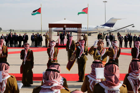 Jordan's King Abdullah II stands next to Palestinian President Mahmoud Abbas (L) during a reception ceremony at the Queen Alia International Airport in Amman, Jordan March 28, 2017. REUTERS/Muhammad Hamed