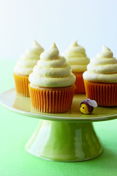 <p>Guests will be buzzing about these fluffy cupcakes, which have grated lemon zest, lemon juice and honey not only in the batter, but in the luscious frosting as well. Add a little sparkle by finishing them with a sprinkling of sanding sugar or a candy bee.</p><p><strong><a href="https://www.womansday.com/food-recipes/food-drinks/recipes/a11157/lemon-honey-cupcakes-recipe-122603/" rel="nofollow noopener" target="_blank" data-ylk="slk:Get the recipe.;elm:context_link;itc:0;sec:content-canvas" class="link ">Get the recipe.</a></strong></p>