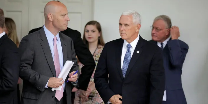 Mike Pence's right-hand man Marc Short (L), joins the then-vice president at a White House bill signing ceremony in 2018.