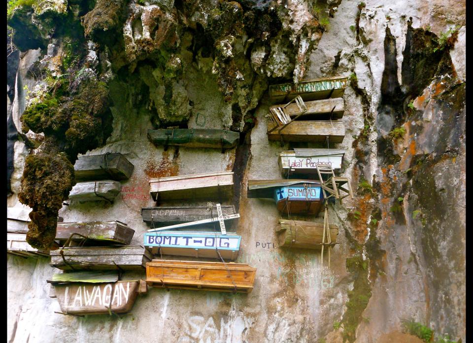 For centuries the indigenous Igorot people of Sagada in the <a href="http://www.cheapflights.com/flights-to-philippines/" target="_hplink">Philippines</a> have practiced a rather unique burial process – hanging coffins from cliffs and caves.    The origins of this ritual are debated, but it is believed the hanging method started as a way to bring the deceased closer to heaven.    The hand-carved wooden coffins are carried through the dense jungle then suspended on ropes and wires. The coffins are often stacked on top of one another.    But this special form of burial isn’t open to just anyone. There are several criteria that need to be met including being married and having grandchildren.    The hanging coffins are now a popular attraction and you can visit these cemeteries in Echo Valley and Lumiang Cave.