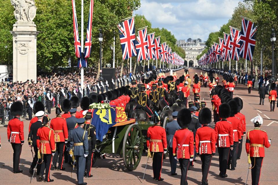 The Queen’s funeral cortege makes its way along The Mall from Buckingham Palace during the procession for the Lying-in State of Queen Elizabeth II