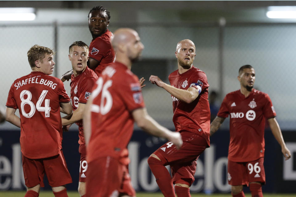 Players of Canada's Toronto FC looks a free kicks by Panama's Club Atletico Independiente FC during a CONCACAF Champions League soccer match in La Chorrera, Panama, Tuesday, Feb., 19, 2019 (AP Photo/Arnulfo Franco)