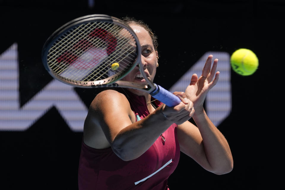 Madison Keys of the U.S. plays a forehand return to Jaqueline Cristian of Romania during their second round match at the Australian Open tennis championships in Melbourne, Australia, Wednesday, Jan. 19, 2022. (AP Photo/Simon Baker)