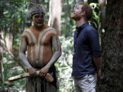 Britain's Prince Harry, the Duke of Sussex, right, attends a dedication ceremony of the forests of K'gari to the Queen's Commonwealth Canopy on Fraser Island, Queensland, Monday, Oct. 22, 2018. The Duke and Duchess of Sussex took separate boats Monday to Queensland's Fraser Island as their tour of Australia and the South Pacific continued with a reduced schedule for the pregnant duchess. (Phil Noble/Pool Photo via AP)