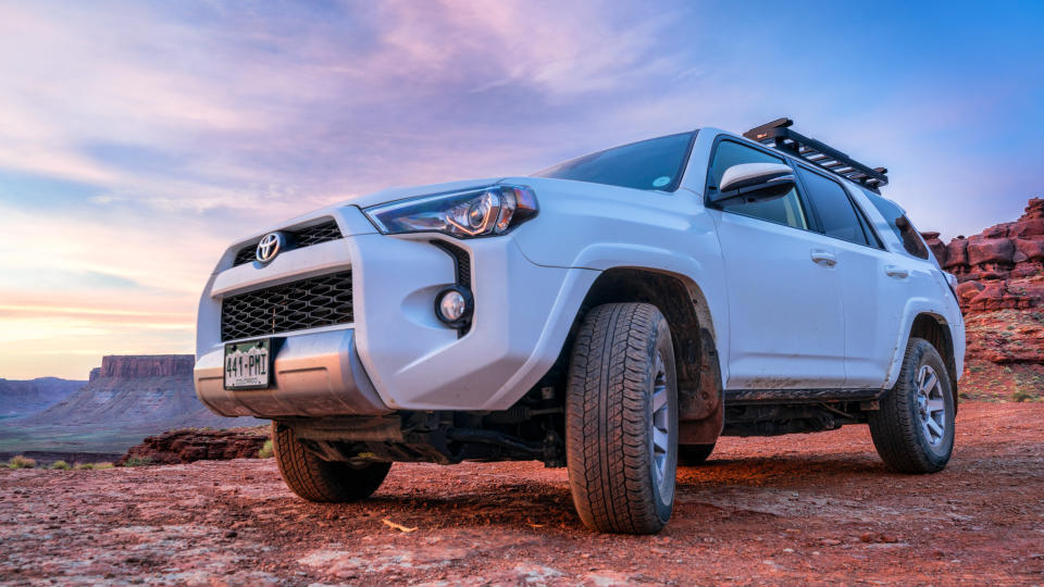 Moab , UT, USA - May 6, 2018:  Toyota 4runner SUV (2016 trail edition, stock vehicle without any off road modifications)) on a desert trail before sunrise in the Moab area.