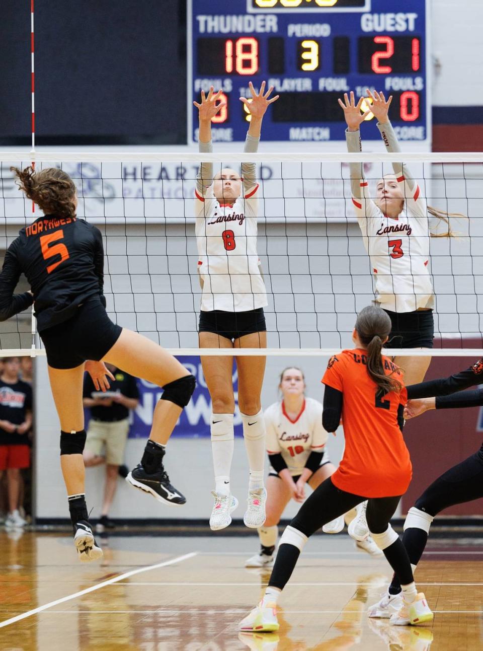 The Lansing High volleyball team competes against Shawnee Mission Northwest at last weekend’s St. James Academy Slam.