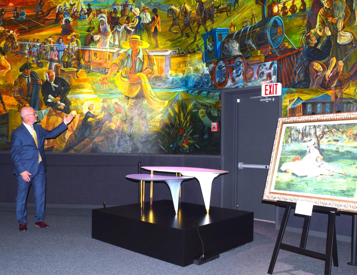 Behalt Executive Director Marcus Yoder describes the connection between the Monet painting, the nesting tables and the cyclorama mural at Behalt.