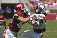 Arkansas linebacker Drew Sanders (42) tackles South Carolina running back Juju McDowell (21) during the first half of an NCAA college football game Saturday, Sept. 10, 2022, in Fayetteville, Ark. (AP Photo/Michael Woods)