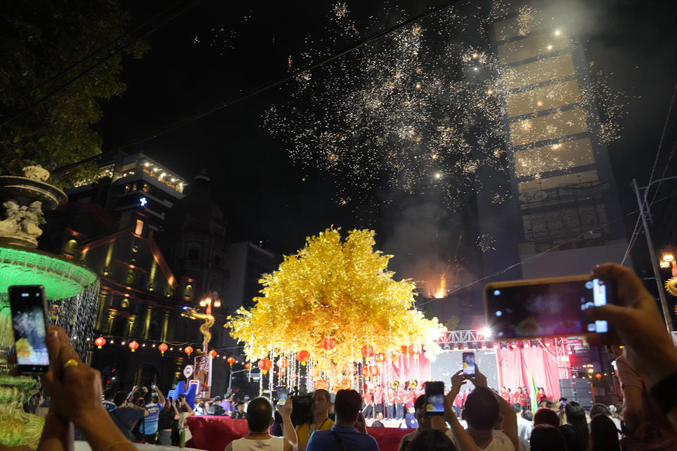 Fireworks lit up during celebrations for the 430th anniversary of Manila's Chinatown, said to be the oldest in the world, at the capital's Binondo district, Philippines on Thursday, Feb. 1, 2024. Crowds are flocking to Manila's Chinatown to usher in the Year of the Wood Dragon and experience lively traditional dances on lantern-lit streets with food, lucky charms and prayers for good fortune. (AP Photo/Aaron Favila)