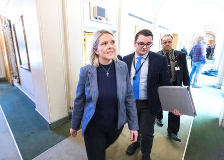 Norway's Justice Minister Sylvi Listhaug and her political adviser Espen Teigen are seen in the Norwegian parlament after several parties supported a motion of no-confidence against her in Oslo, Norway March 15, 2018. Picture taken March 15, 2018. NTB Scanpix/Gorm Kallestad via REUTERS