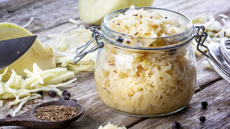 Open glass jar of sauerkraut