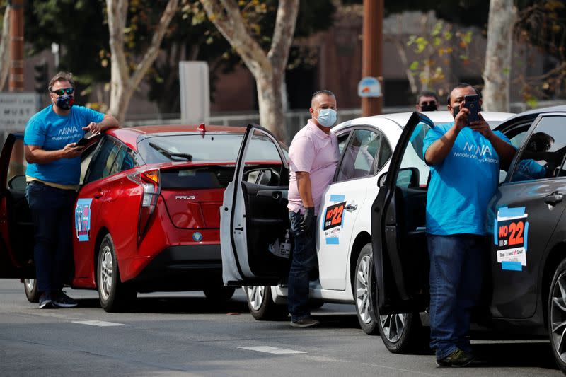 FILE PHOTO: App-based gig workers hold demonstration outside Los Angeles City Hall to urge voters to vote no on Proposition 22 in California