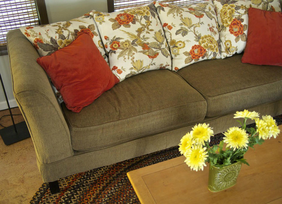 <body> <p>For a quick update to this piece of <a rel="nofollow noopener" href=" http://www.bobvila.com/slideshow/20-insanely-easy-ways-to-build-your-own-furniture-49790?bv=yahoo" target="_blank" data-ylk="slk:furniture;elm:context_link;itc:0;sec:content-canvas" class="link ">furniture</a>, the homeowners first exposed the lovely legs that had been obscured by the couch skirt. Then, to amend the sunken seat cushions, they removed the old stuffing and replaced it with Poly-Fil batting. Finally, they traded in the floppy cushions along the back of the sofa for plush pillows that can be easily swapped out as styles change.</p> <p><strong>Related: <a rel="nofollow noopener" href=" http://www.bobvila.com/slideshow/10-ways-to-give-furniture-a-fast-facelift-49358?bv=yahoo" target="_blank" data-ylk="slk:10 Ways to Give Furniture a Fast Facelift;elm:context_link;itc:0;sec:content-canvas" class="link ">10 Ways to Give Furniture a Fast Facelift</a> </strong> </p> </body>