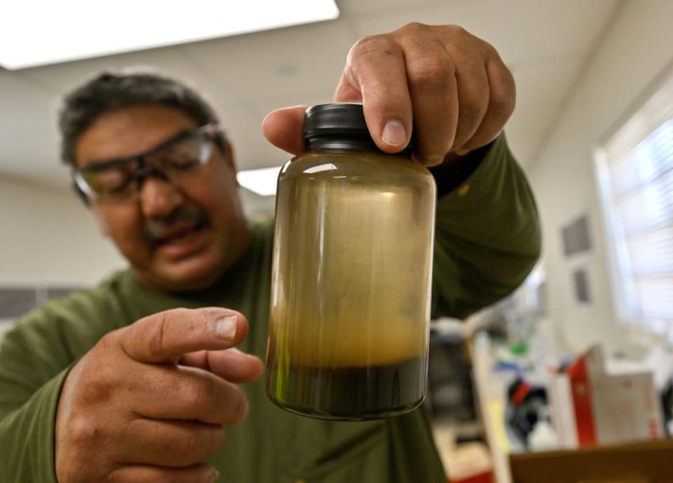 Emir Salas, lead chemist at Controlled Thermal Sources, shows off brine with metals extracted.