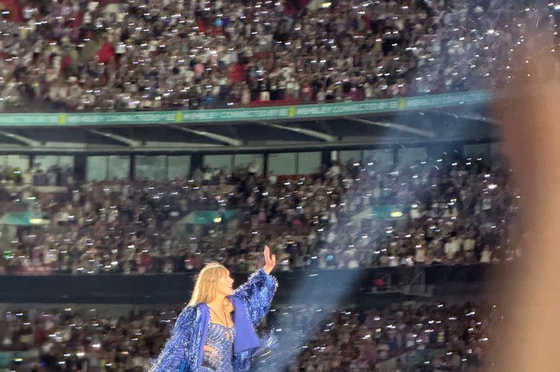 Taylor waving to the crowd at the end of the Eras Tour