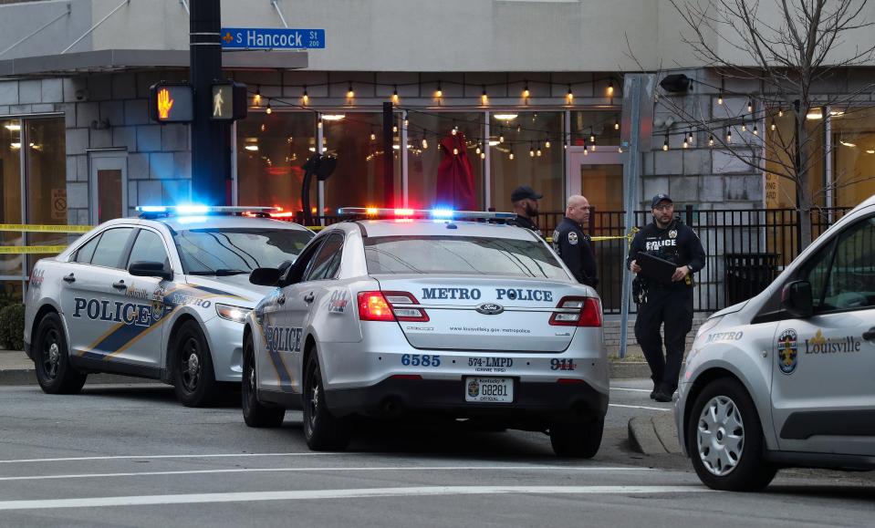 The LMPD investigate the scene where four people were shot at the Seafood Lady restaurant in the NuLu district of Louisville, Ky. on Mar. 6, 2022.  